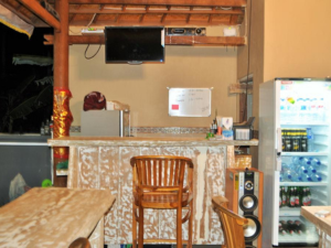 kitchen corner with bar table and refrigerator Deva Devi Beach Inn