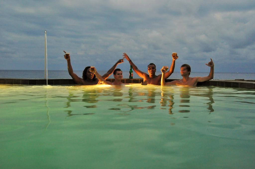swimming pool and view beach Cemara’s Beach Homestay